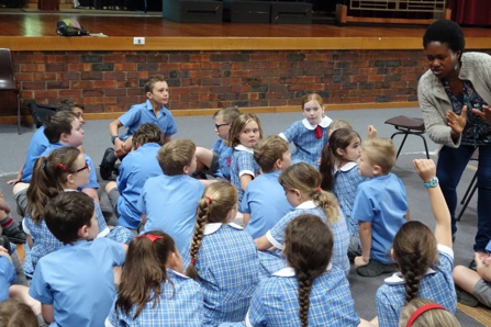 Teacher talking to group of children